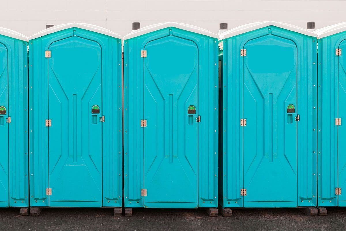 Row of portable toilets available for long-term rental agreements
